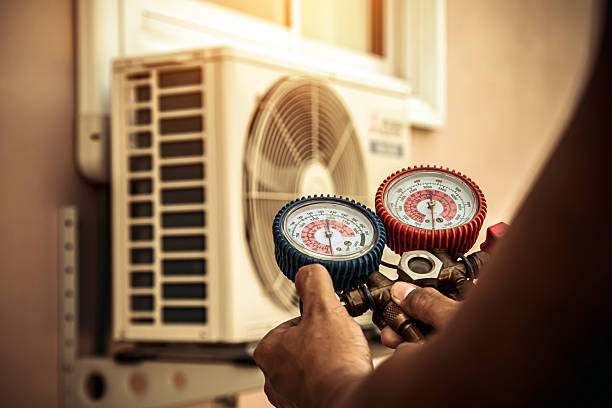 Professional Air Conditioning Service technician working in Fulton, KY